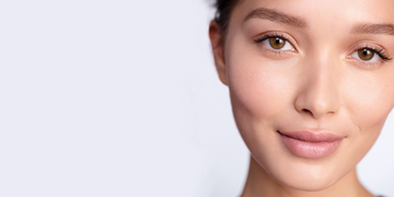 Close-up of a woman with smooth, radiant skin, showcasing a healthy and natural glow.